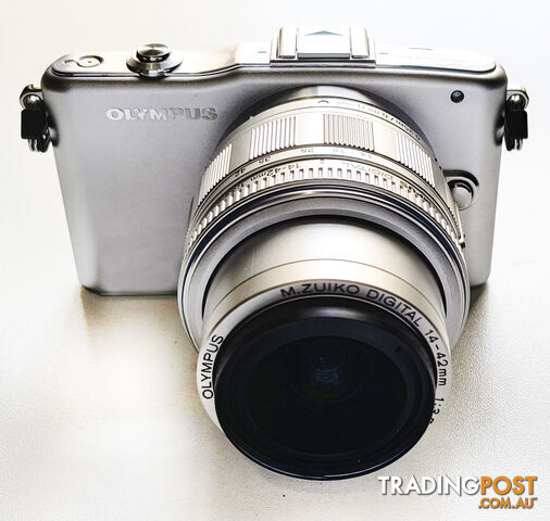 Olympus Pen Mini E-PM1 12.3 Megapixel Mirrorless Camera with 14-42mm/3.5 Lens