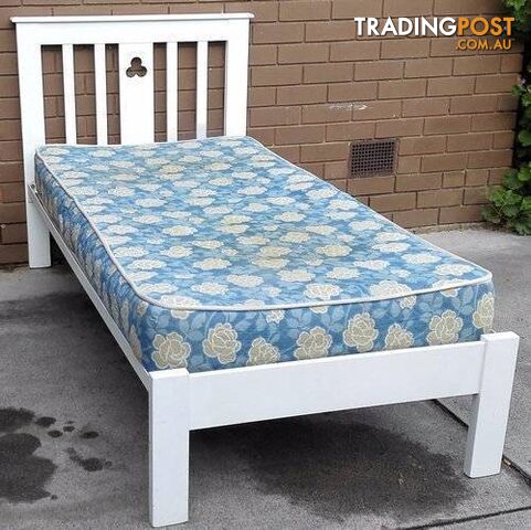 white single bed frame with mattress
