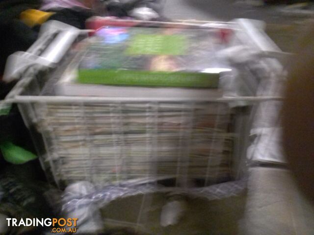 big stack of gardening magazines and books