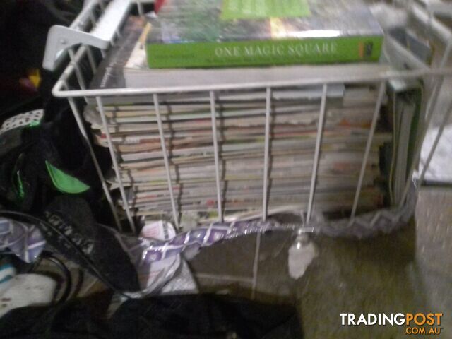 big stack of gardening magazines and books