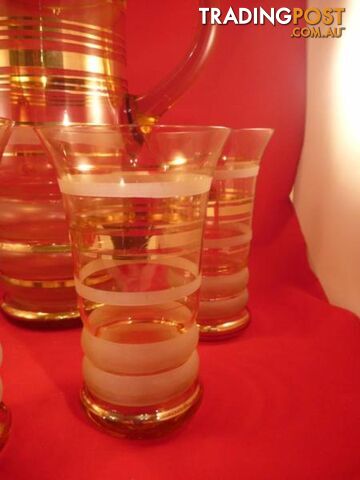 vintage golden ringed jug and 5 glasses
