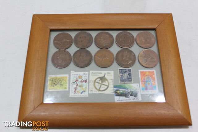 Penny&amp;#39;s and old stamps in picture frame