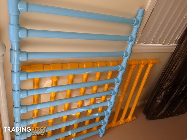 Bright, multicolor metal cot.