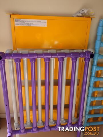 Bright, multicolor metal cot.