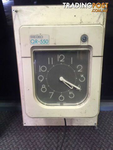 Staff Clocking Time Card Machine