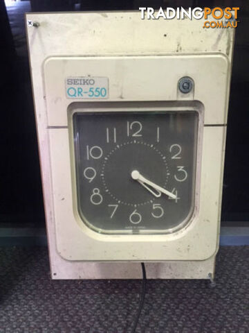 Staff Clocking Time Card Machine