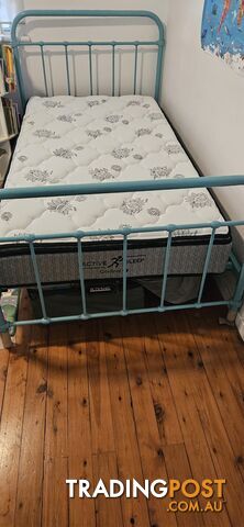 King Single Steel bed frame with a wooden slat base and Active Sleep Control King Single mattress