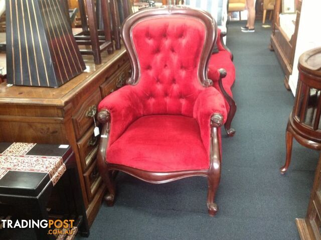 Wingback armchair in gorgeous red with carved timber frame