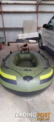 Inflatable dinghy with outboard and bracket